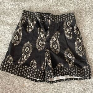 Black paisley shorts with stretch band in back. Size XS.